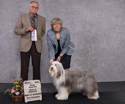 Tegan in a "show photo" when she completed her Canadian championship. She is with her mommy and the judge.